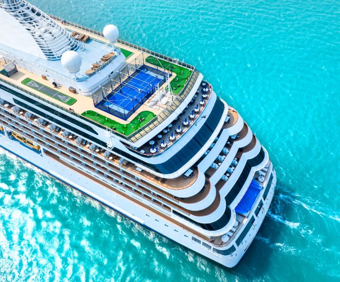 A cruise ship in clear blue water.