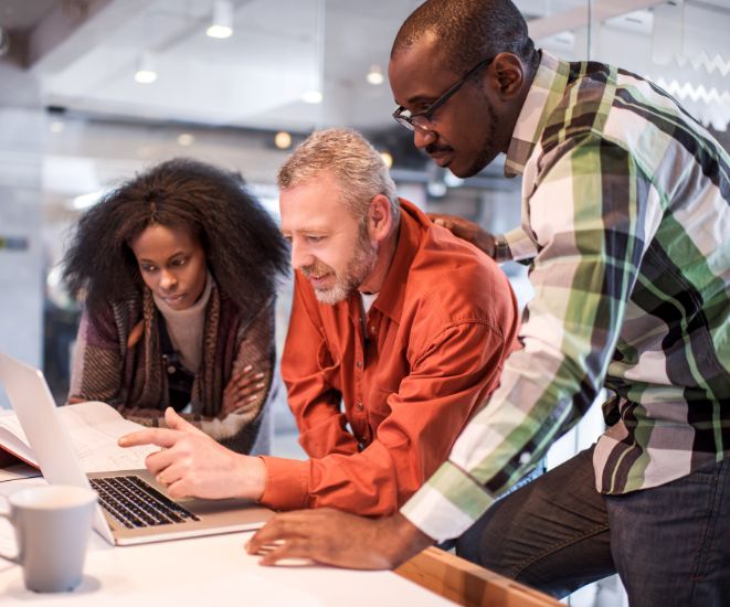 Small business owners looking at a laptop.